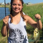 Girl holding sunfish