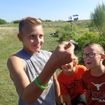 Kids holding a small fish